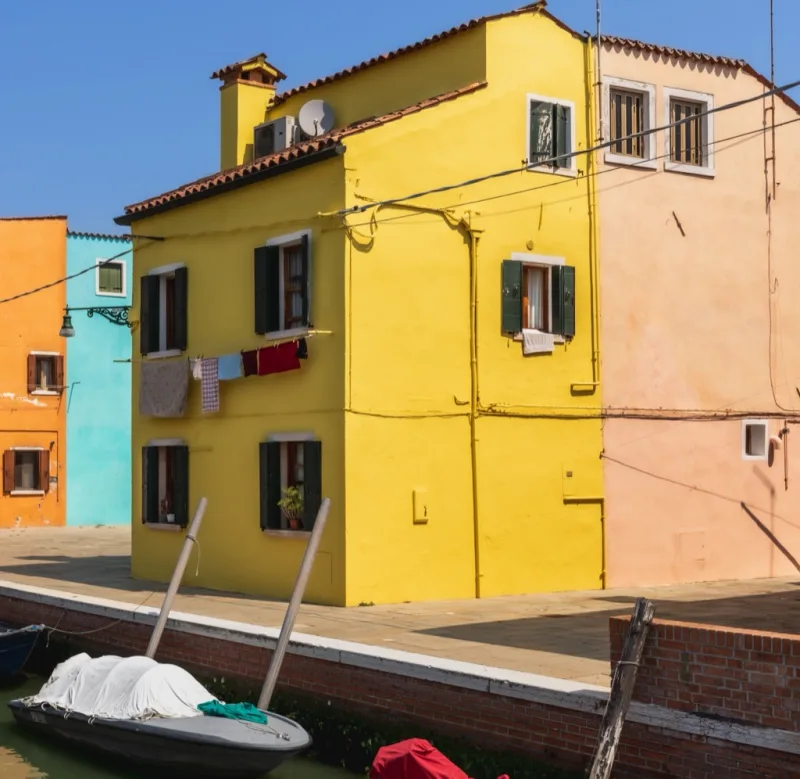 The original digital photograph: a yellow house on a canal in Burano, before developing